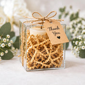 Natural brown paper shred used as gift box filler holding a candle with a Thank You tag - thumbnail number 7