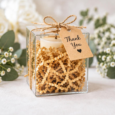 Natural brown paper shred used as gift box filler holding a candle with a Thank You tag - thumbnail number 7