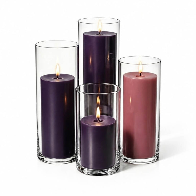Lit Advent Pillar Candles & Cylinder Holders set of 4 on a white backdrop - thumbnail number 2