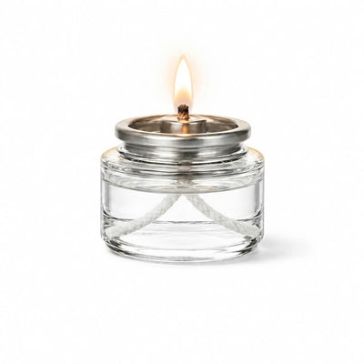 Lit Liquid Paraffin Fuel Cell in clear glass container with silver top and white wick - thumbnail number 2
