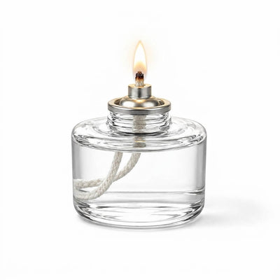 Lit Liquid Paraffin Fuel Cell in clear glass container with white wick on white background - thumbnail number 2