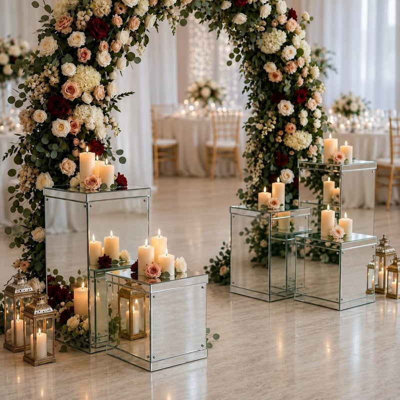 Silver mirrored acrylic display boxes holding candles under a large floral wedding arch - thumbnail number 5