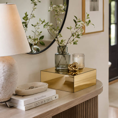Gold mirror finish acrylic pedestal riser styled with a glass vase of branches and a candle - thumbnail number 3
