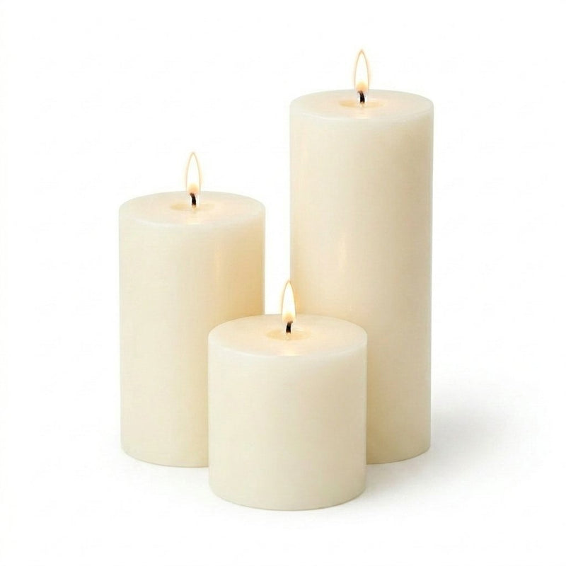 Three white candles of different sizes on a white background - thumbnail number 2
