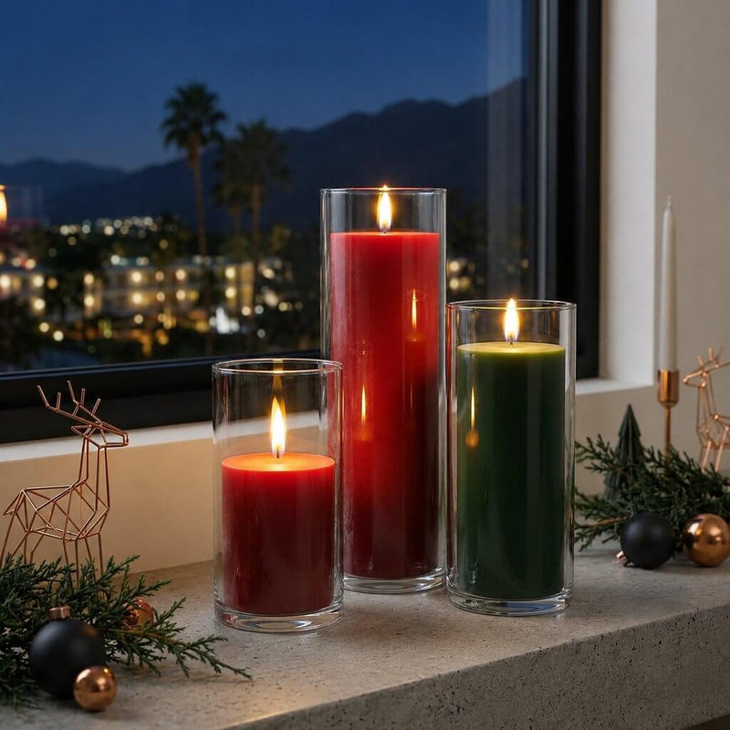 Lit red and green pillar candles in glass vases on a window sill - thumbnail number 7