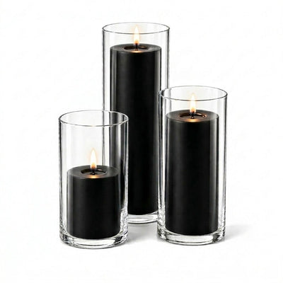 A set of three lit black candles in glass cylinders - thumbnail number 2