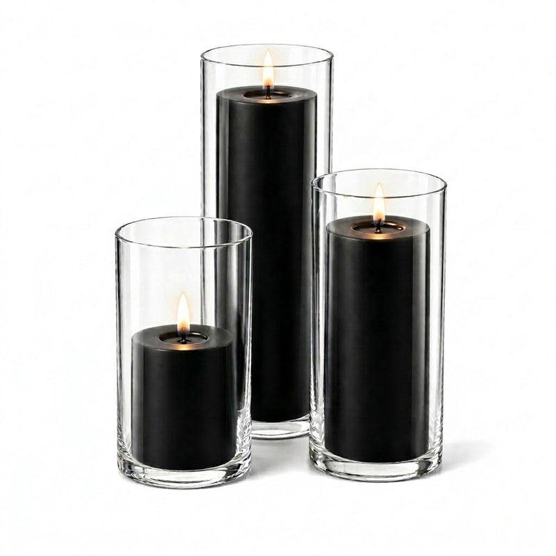 A set of three lit black candles in glass cylinders - thumbnail number 2