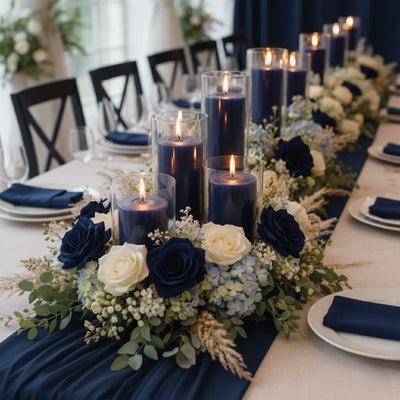 Navy blue candles in glass holders with white and blue floral centerpiece - thumbnail number 5