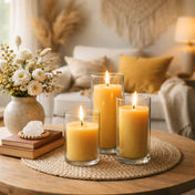 Three yellow pillar candles in glass holders on cozy living room coffee table - thumbnail number 6