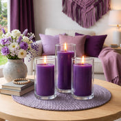 Purple pillar candles in glass cylinders on a woven lavender placemat - thumbnail number 8