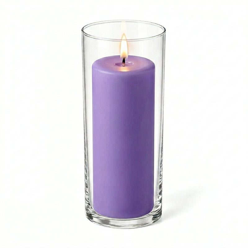 Lavender pillar candle burning inside a cylindrical glass vase - thumbnail number 2