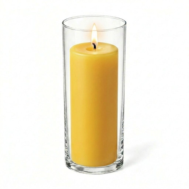 Lit yellow pillar candle displayed in a transparent glass holder - thumbnail number 2