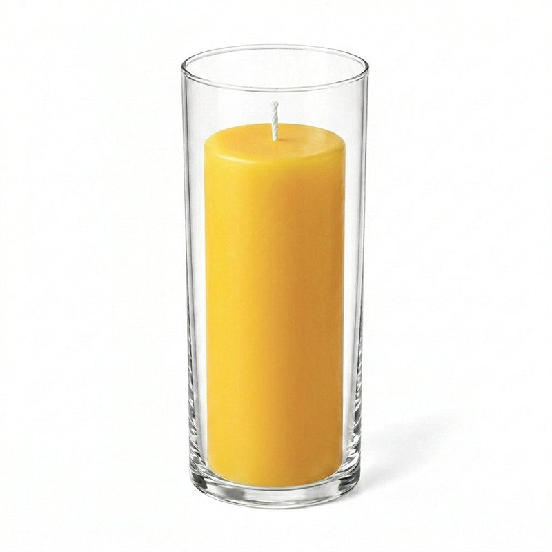 Tall yellow pillar candle displayed in a transparent glass holder - thumbnail number 1