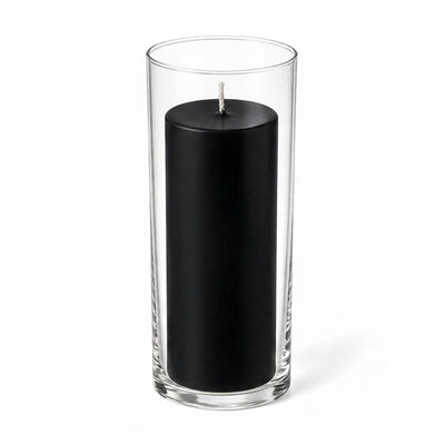 Black pillar candle inside a clear glass cylinder vase - thumbnail number 1