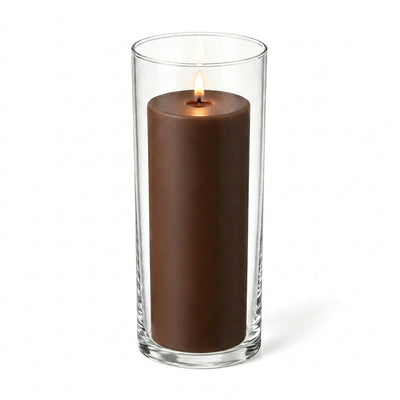 Brown candle with flame displayed in a tall transparent glass holder - thumbnail number 2
