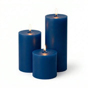 Three blue candles of different sizes on a white background - thumbnail number 2