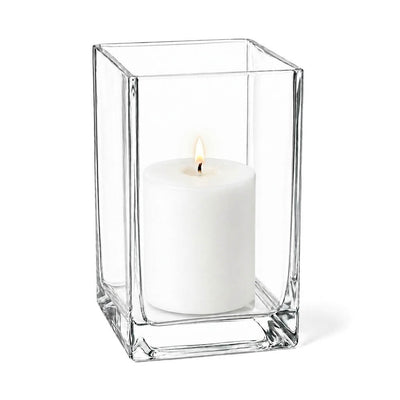 Clear 6" square vase containing a lit white pillar candle - thumbnail number 3