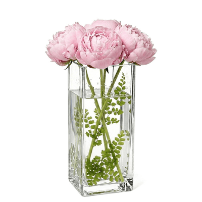 Clear 12" square vase filled with water, green foliage, and light pink peonies - thumbnail number 6