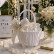 White basket decorated with linen ribbon bow and small favor bags - thumbnail number 5