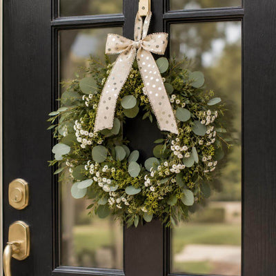 Green wreath with silver dot linen bow hanging on a door - thumbnail number 8