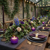 Purple glass candle holder with a lit candle on a decorated event table - thumbnail number 8