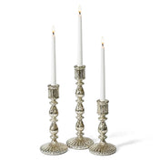 Three lit candles in a Ribbed Unique Mercury Glass Taper Candle Holder on a white background - thumbnail number 3