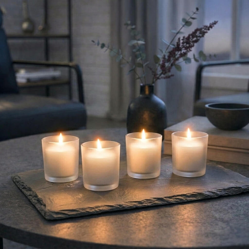 Cozy living room coffee table setting with ivory Frosted Votive Holders on slate - thumbnail number 8