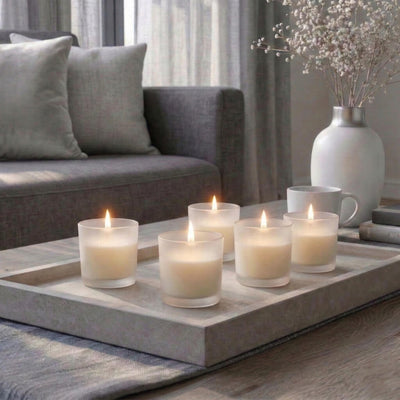 Cozy modern living room scene with ivory Frosted Votive Holders on a tray table - thumbnail number 9