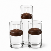 Three lit brown floating candles set inside tall glass cylinders - thumbnail number 1