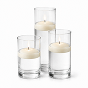 Three light ivory floating candles in glass cylinders on a white background - thumbnail number 1