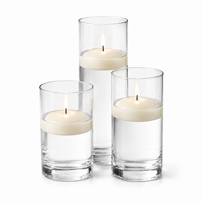 Three light ivory floating candles in glass cylinders on a white background - thumbnail number 1