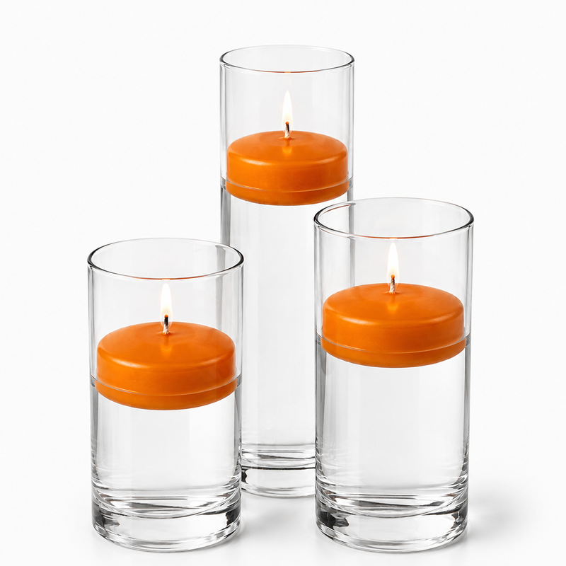 Three orange floating candles burning in glass cylinders - thumbnail number 1