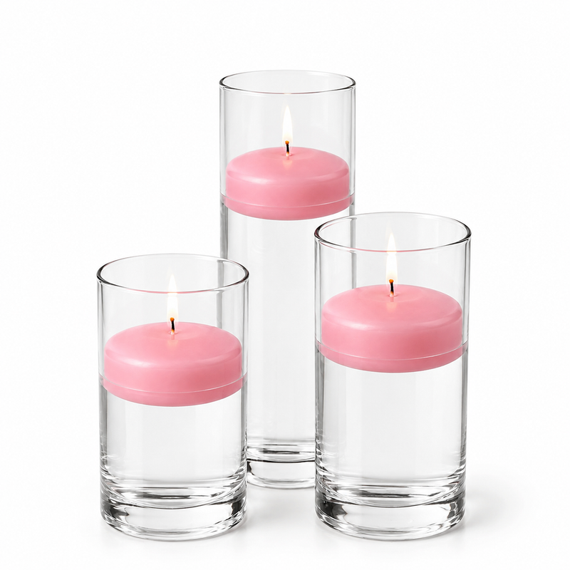 Three pink floating candles lit in glass cylinders - thumbnail number 1