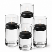 Four glass cylinders with water and lit black floating candles. - thumbnail number 1