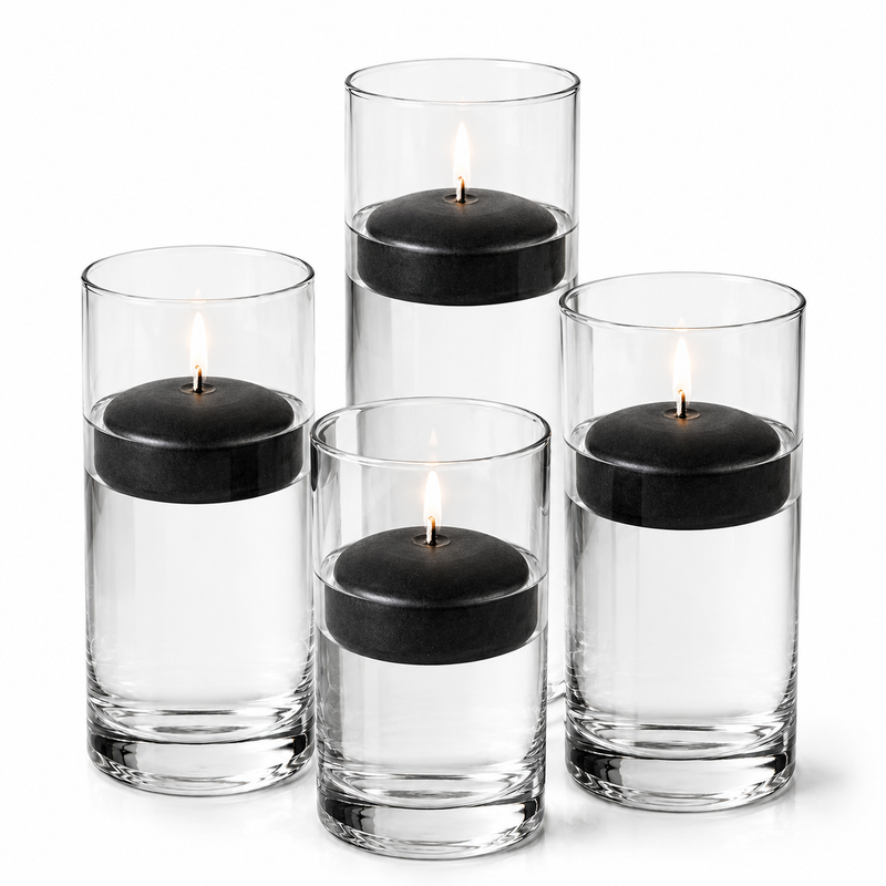 Four glass cylinders with water and lit black floating candles. - thumbnail number 1