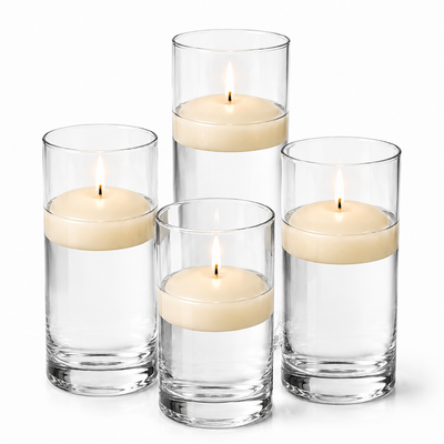 Four glass cylinders filled with water hold lit ivory floating candles. - thumbnail number 1