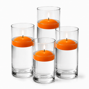 Four glass cylinders filled with water hold lit orange floating candles - thumbnail number 1
