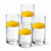 Four glass cylinders filled with water hold lit yellow floating candles - thumbnail number 1