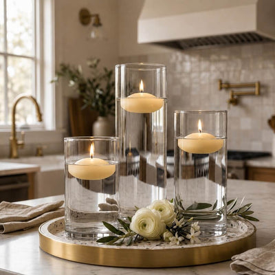 Three lit ivory floating candles in cylinder vases on a brass-rimmed tray - thumbnail number 7
