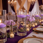 Glass cylinders with floating lavender candles and purple roses on a banquet table - thumbnail number 5