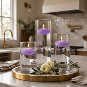Three glass cylinders with floating lavender candles and white flowers on a tray - thumbnail number 7
