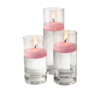 Pink floating candles burning inside water-filled glass cylinders - thumbnail number 2
