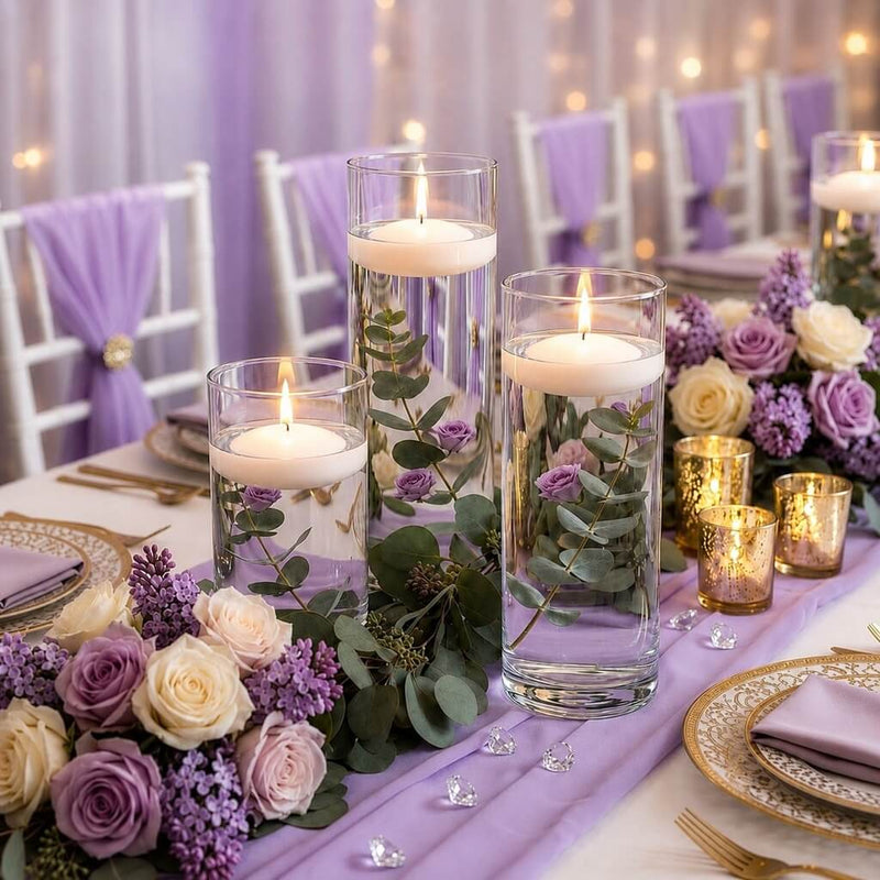 Three glass cylinder vases with lit white floating candles and flowers - thumbnail number 5