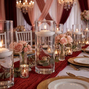 Glass cylinder vases with lit white floating candles and pink roses - thumbnail number 3