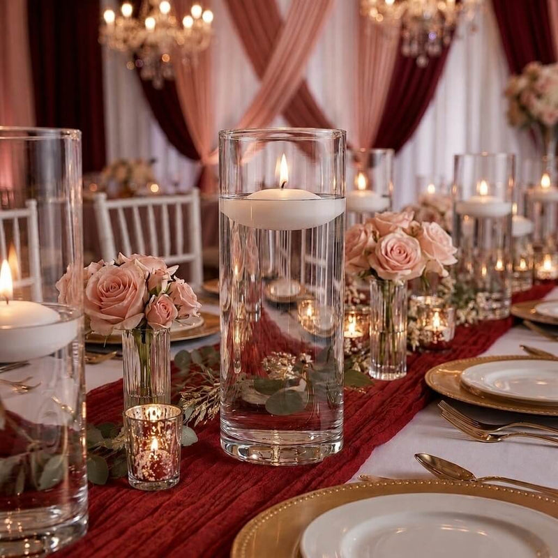 Glass cylinder vases with lit white floating candles and pink roses - thumbnail number 3