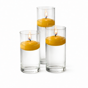 Three yellow floating candles burning in tall glass cylinders - thumbnail number 2
