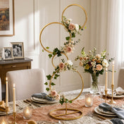Gold metal 4-tier hoop pillar stand styled with roses and greenery as a dining centerpiece - thumbnail number 10