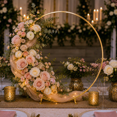 Gold hoop wedding centerpiece with blush flowers and fairy lights on a table - thumbnail number 7