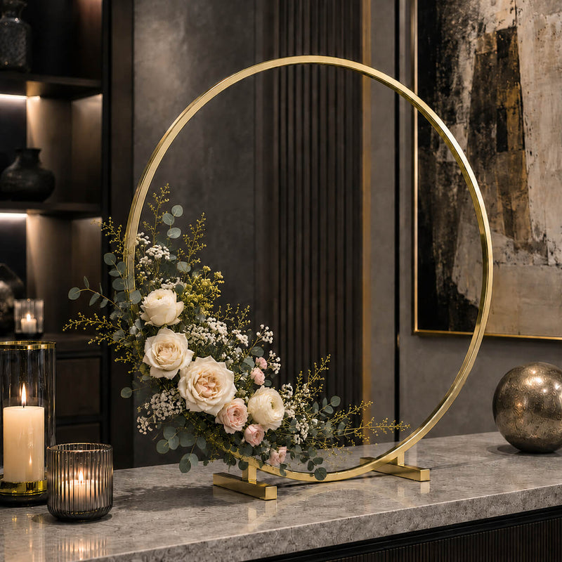 Gold hoop centerpiece with flowers and eucalyptus on a marble counter - thumbnail number 8