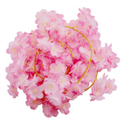 Pink cherry blossom LED garland string lights with warm white glow on white background - thumbnail number 1